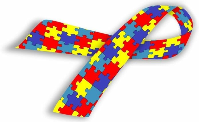 Descrição da imagem #PraTodosVerem: Imagem no formato retangular, na horizontal. Um laço colorido, símbolo do autismo. Fim da descrição.