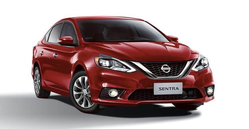 Descrição da imagem #PraCegoVer: Imagem em formato retangular, na horizontal. Nela está o modelo Nissan Sentra,,na cor vermelho malbec, o sedã de luxo da Nissan. Fim da descrição.