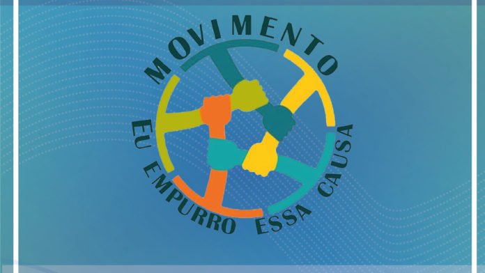 Descrição da imagem #PraCegoVer: Imagem no formato retangular, na horizontal. Logo do movimento 'Eu poio essa causa', formado por um círculo , colorido, que tem cinco mãos que estão segurando o punho do outro, formando uma espécie de corrente humana. A imagem tem fundo azul. Fim da descrição.