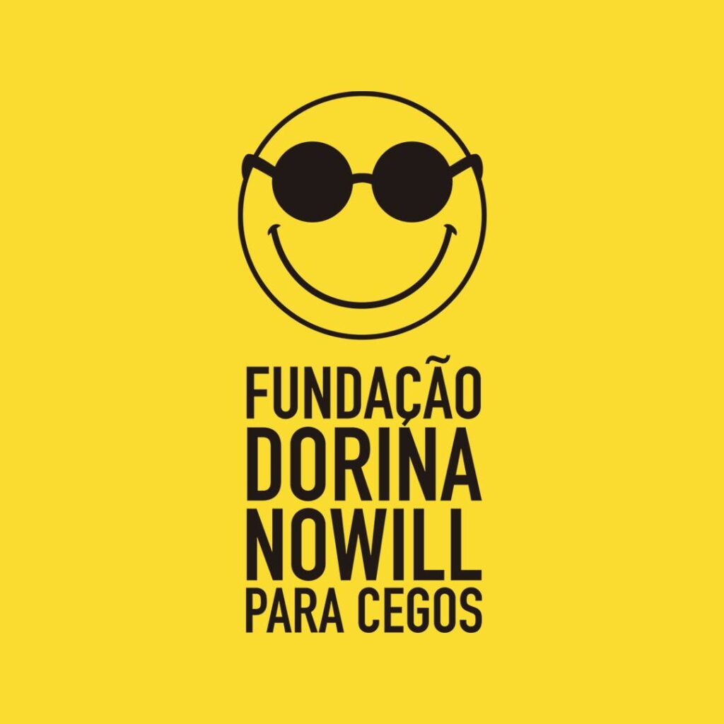 Descrição da imagem #pracegover: Logo da Fundação Dorina. Ele composto da imagens na cor preta: um círculo com óculos escuros e um sorriso em forma de meio círculo. O fundo da imagem é amarelo. Abaixo da imagem está escrito, em letras pretas: Fundação Dorina Nowill para Cegos Fim da descrição.