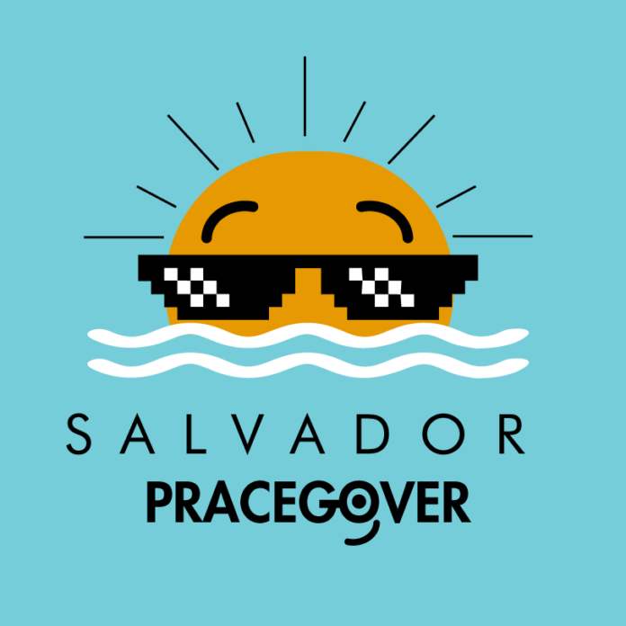 Descrição da imagem #pracegover: Arte com fundo azul-esverdeado com ondulações como o fundo do mar, está a identidade visual do Salvador Pra Cego Ver, na região central, em destaque. Ela é constituída de um emoji irônico, usando óculos escuros de mito, que surge por trás de duas linhas onduladas azuis. Em volta de sua cabeça, tracinhos como os raios do sol. Abaixo das linhas onduladas, a palavra Salvador. Abaixo dela, o termo 'Pra Cego Ver'. O traço da letra G se une à letra O formando uma lupa. No centro do O tem um ponto e abaixo um tracinho que formam um olho e um sorriso. Fim da descrição.